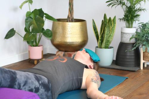 Woman laying on a yoga mat